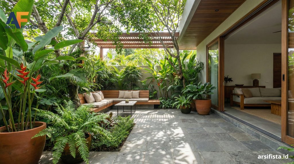 Teras hijau hadir sebagai area transisi yang mengaburkan batas antara interior dan eksterior, sekaligus berfungsi menurunkan suhu mikro di sekitar area hunian utama.